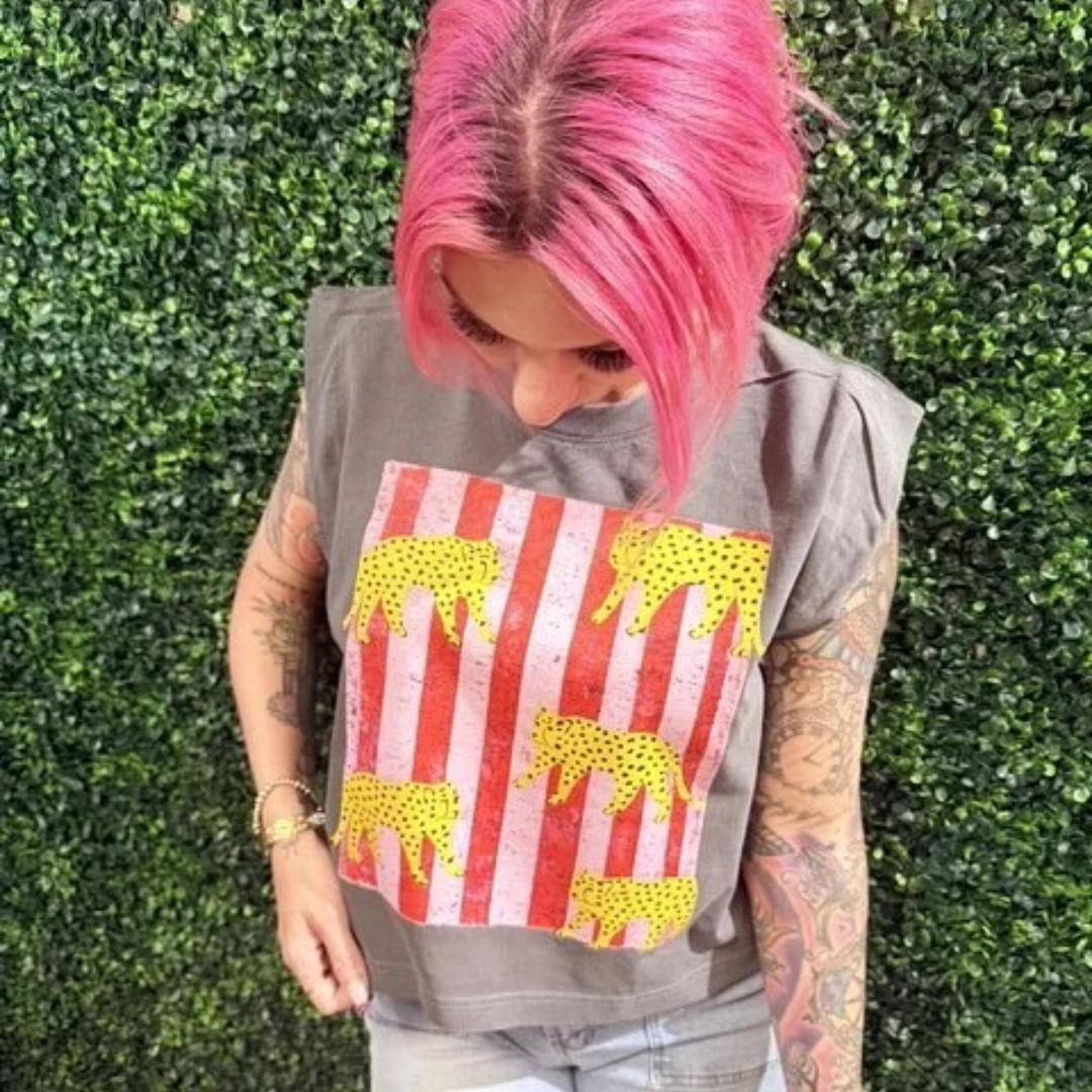 Vintage taupe sleeveless graphic tee featuring a distressed patriotic striped design with yellow leopard silhouettes.