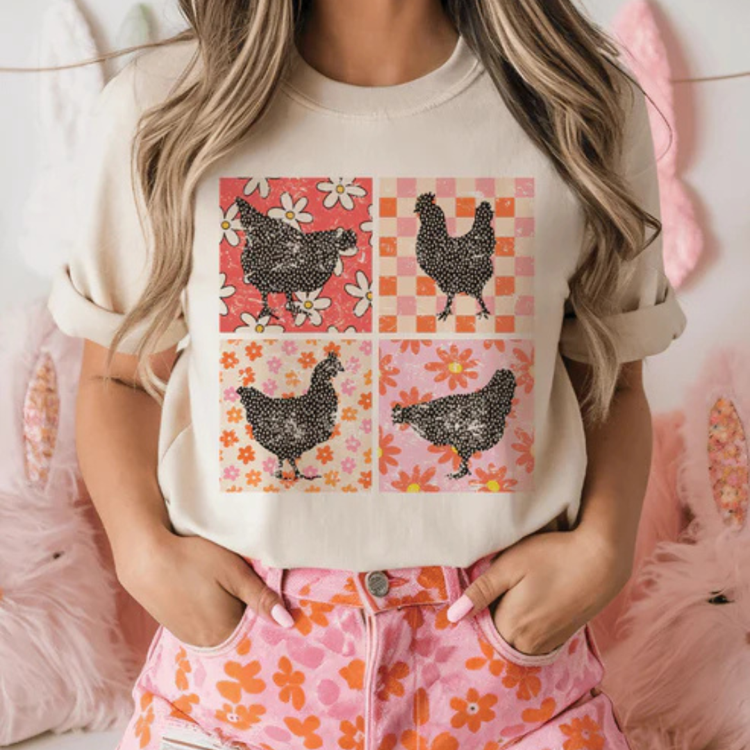 Cream graphic t-shirt featuring four patterned chickens with floral and gingham patchwork artwork.