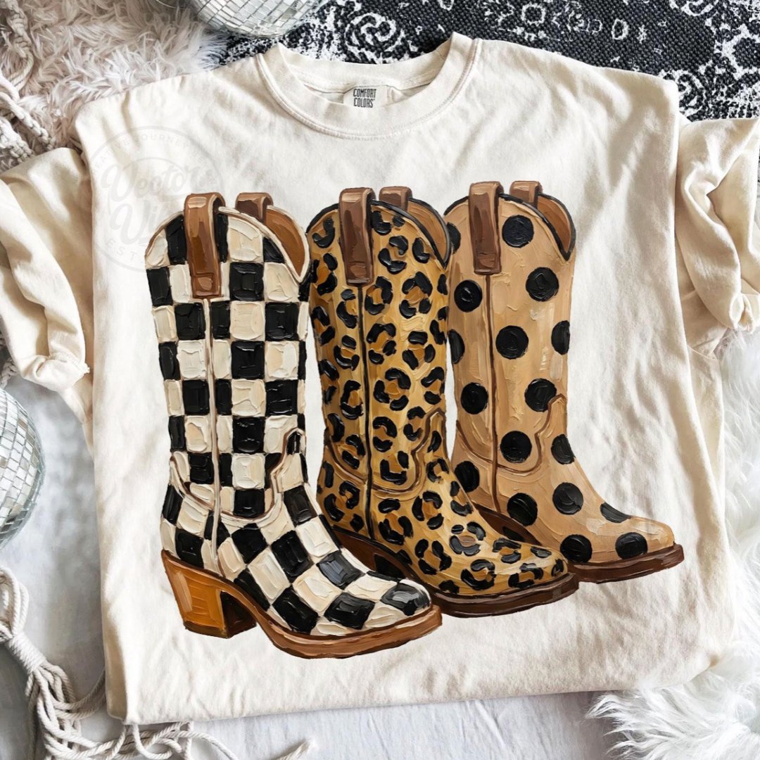 Natural cream graphic tee featuring three western boots in checkered, leopard, and polka dot prints.