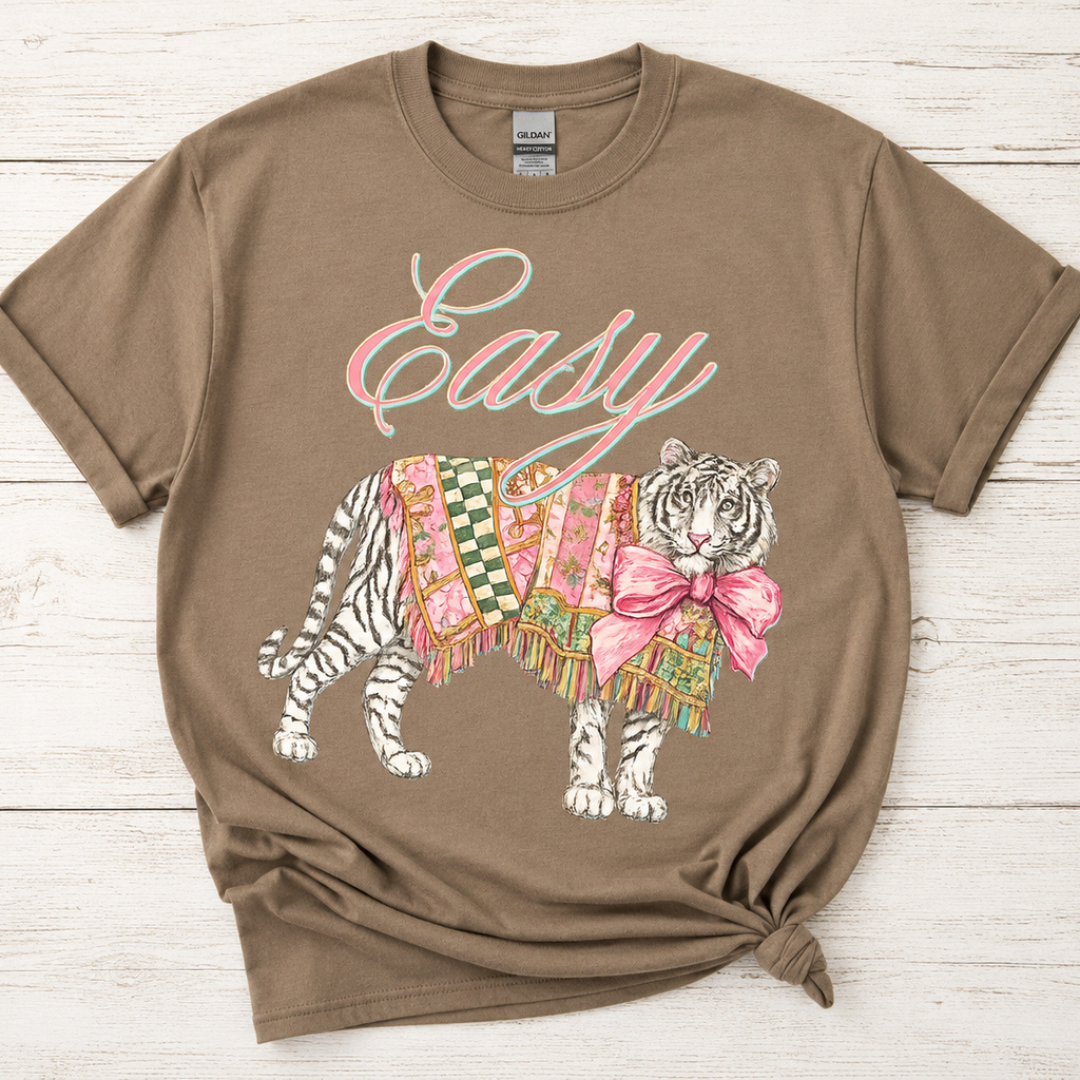 Taupe brown graphic tee featuring a patchwork tiger with a pink bow and Easy script graphic.