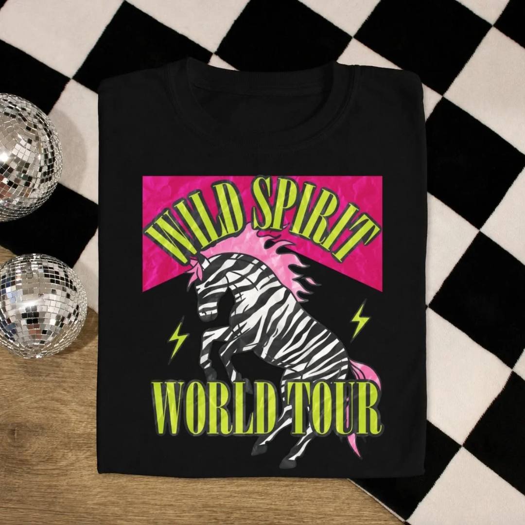 Black graphic tee featuring a zebra graphic with neon pink and chartreuse "Wild Spirit World Tour" design.