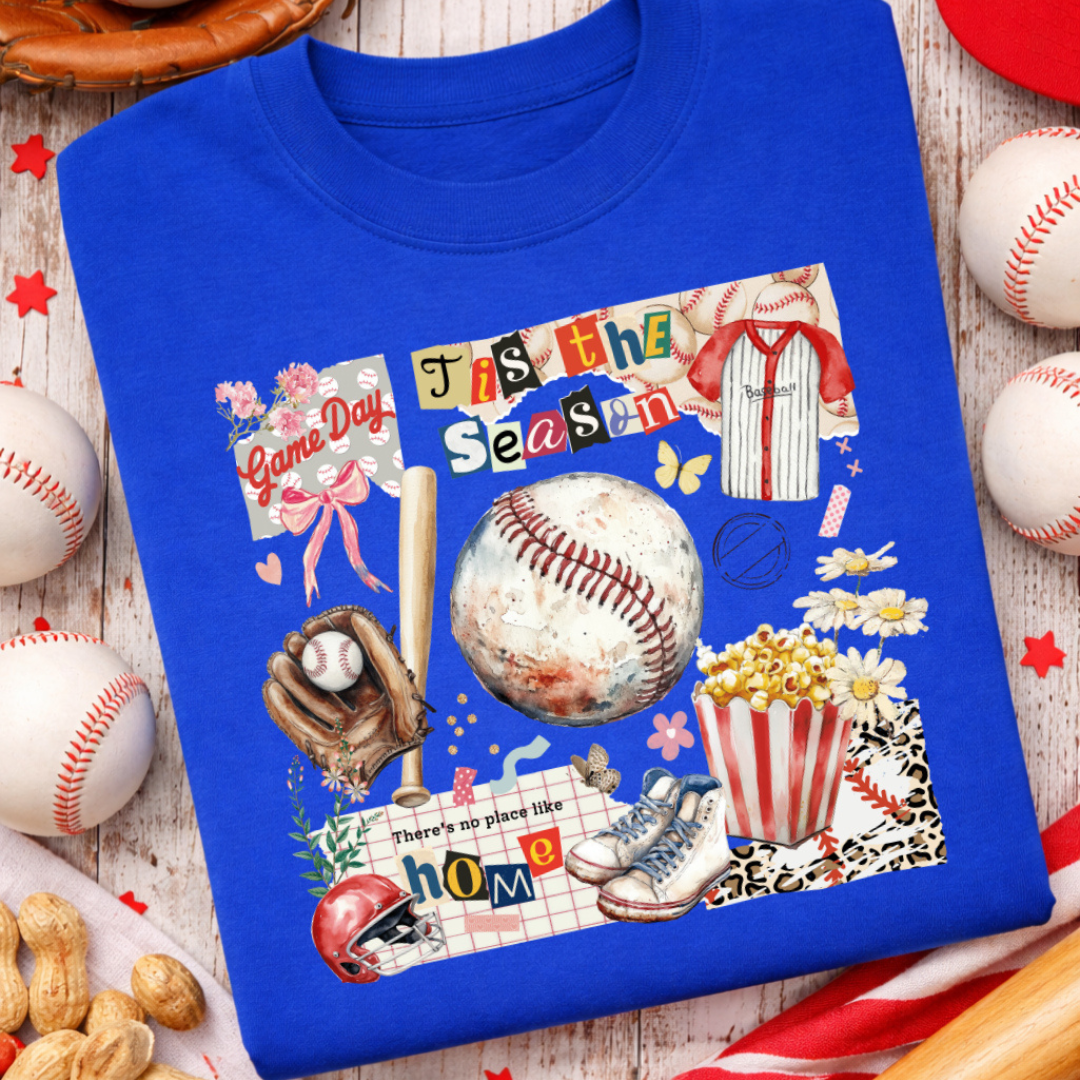 Royal blue graphic tee featuring a vintage-inspired baseball collage with a baseball, glove, bat, popcorn, helmet, jersey, sneakers, flowers, bows, and game day phrases.