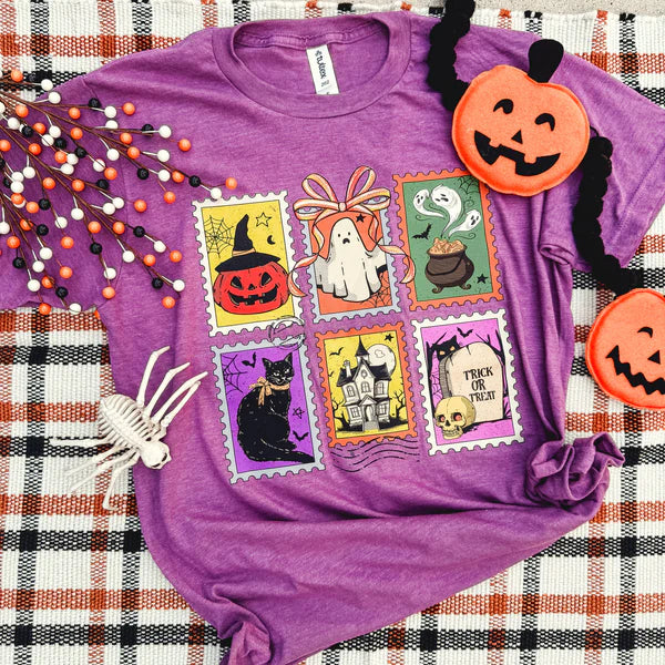 Purple t-shirt with Halloween-themed stamps and decorations on a plaid fabric background