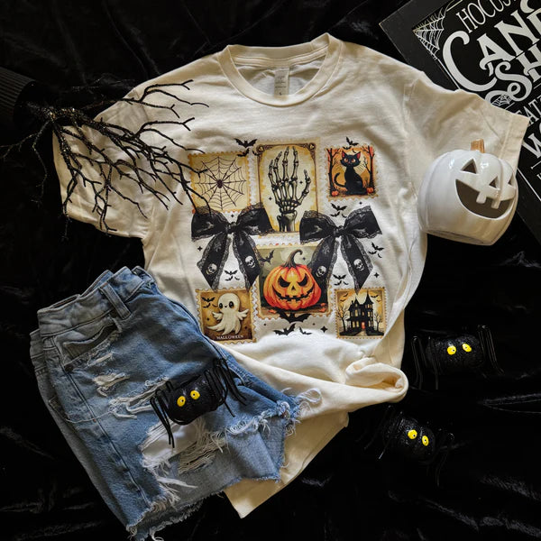 Halloween-themed t-shirt with graphics, denim shorts, and decorative items on a dark background
