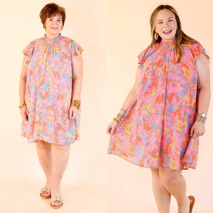 The Out On The Town dress is a vibrant must-have for your wardrobe. Crafted from lightweight fabric, you will stay cool and comfortable throughout the day. With a distinctive floral pattern, ruffle cap sleeves and a smocked neckline, this dress is sure to turn heads. The pleated design adds an extra touch of elegance.