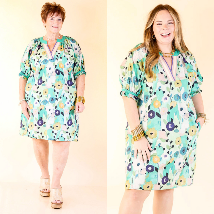 This abstract floral features a flattering v-neckline with contrasting striped trim for a modern twist, while the ruffle sleeves add a soft, touch. Sizes XL to 2X.