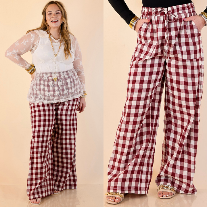 Models are wearing ivory and maroon gingham drawstring pants on a beige background