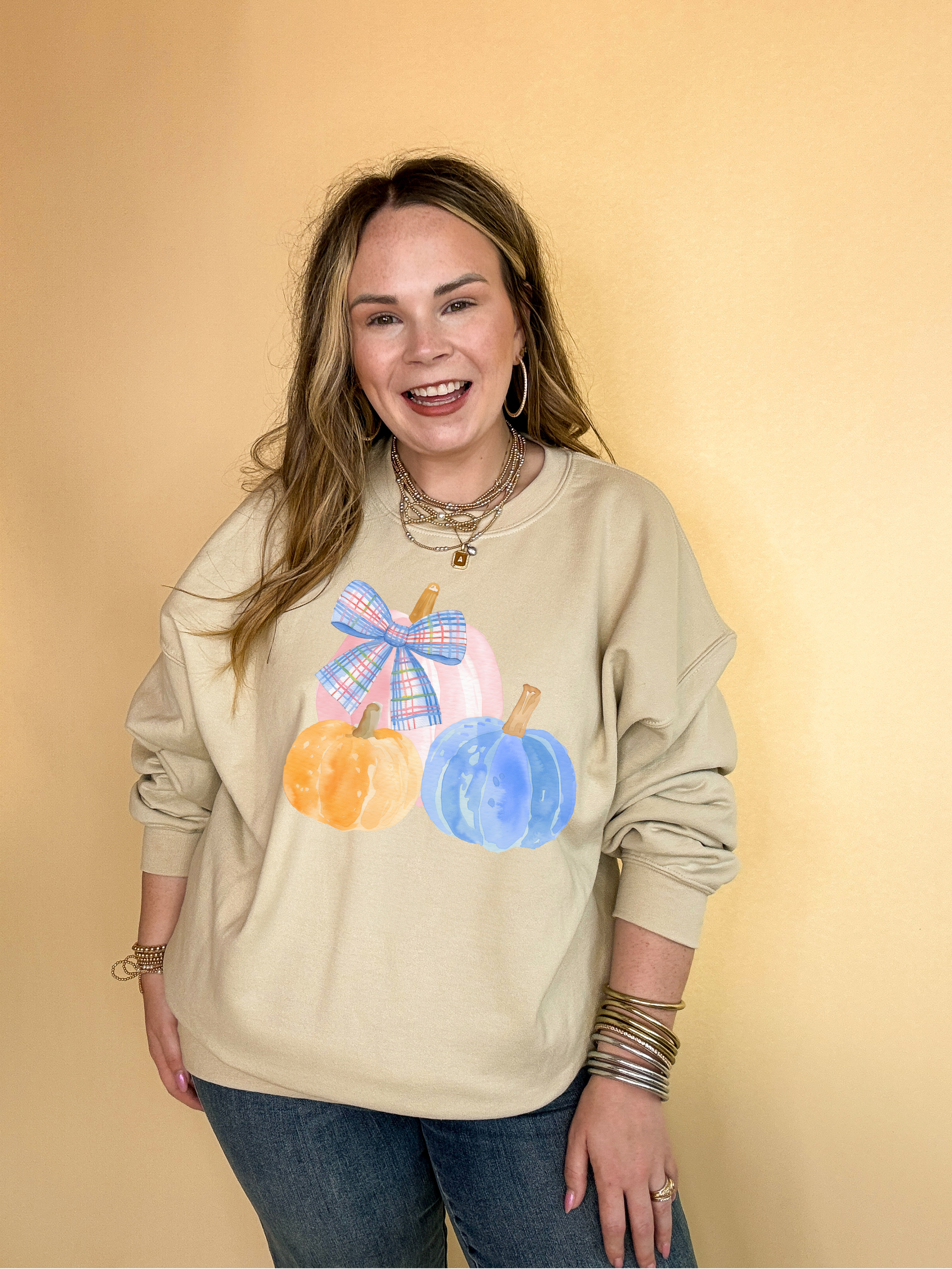 Online Exclusive | Pastel Patch Pumpkins in Orange, Pink and Blue with Plaid Bow Graphic Sweatshirt in Multiple Color Options