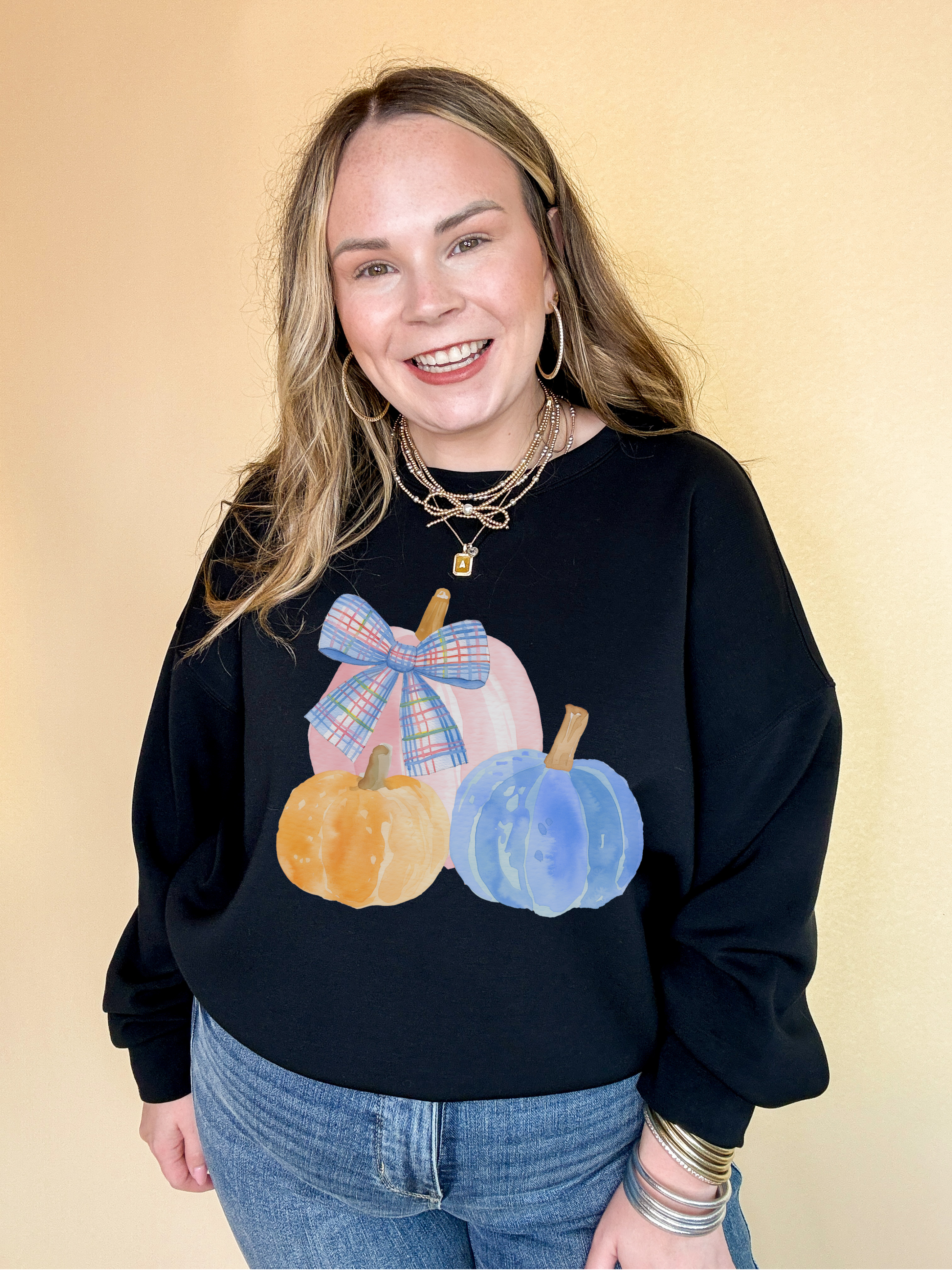 Online Exclusive | Pastel Patch Pumpkins in Orange, Pink and Blue with Plaid Bow Graphic Sweatshirt in Multiple Color Options