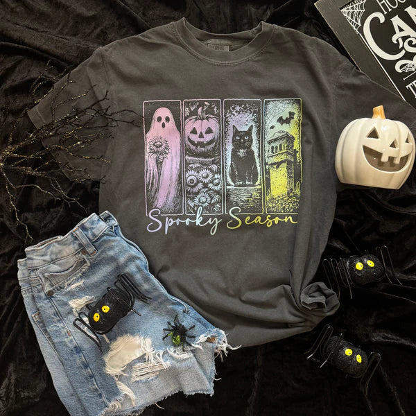 Gray t-shirt with Halloween-themed design and shorts on a dark background