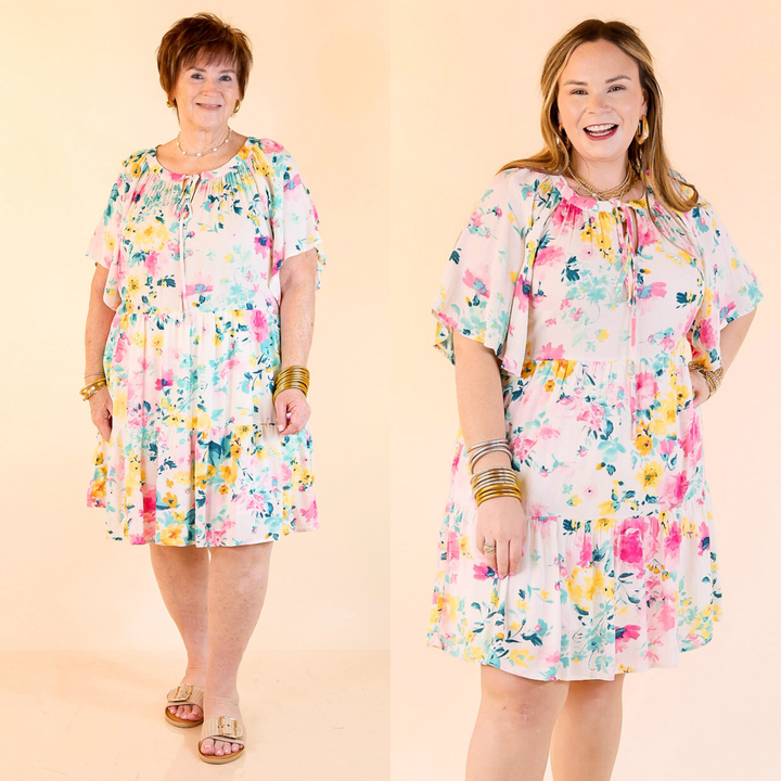 This adorable dress includes short sleeves with ruffle detailing, a ruffle tiered body, and v neckline. Available in sizes small through plus size. 