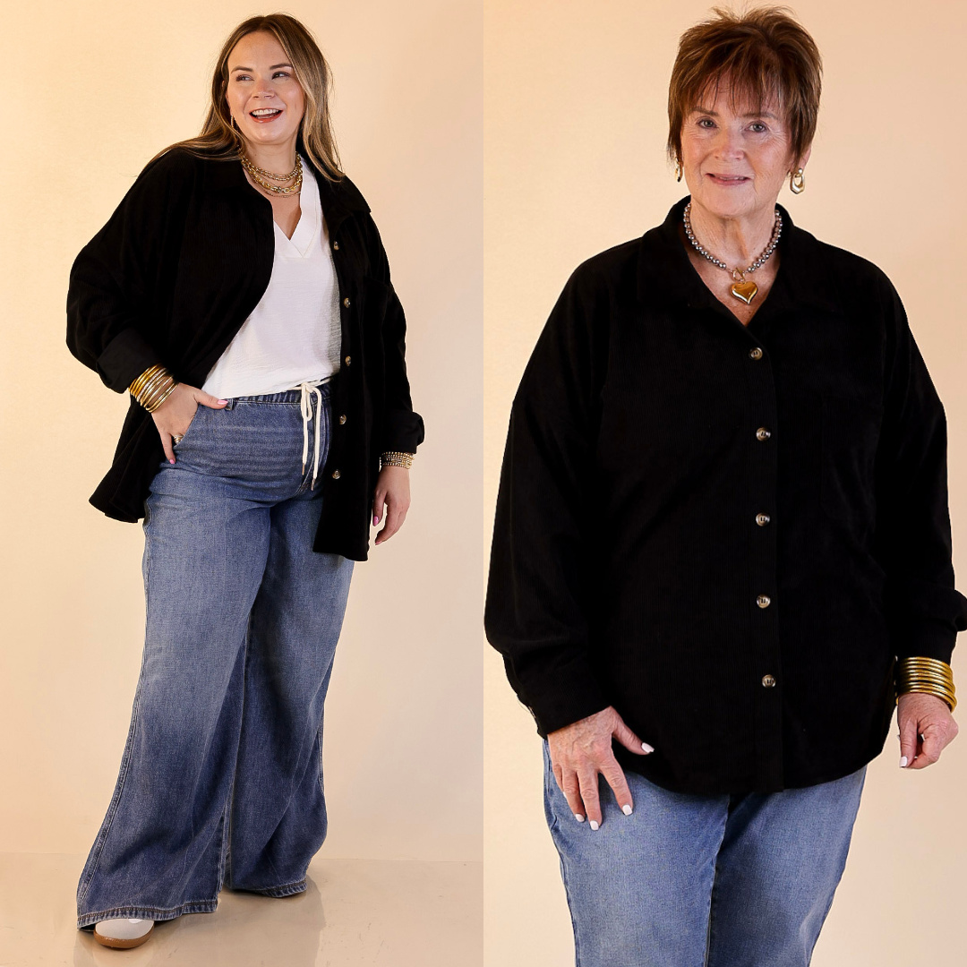 Models are wearing a corduroy shacket in black and blue jeans with a beige background