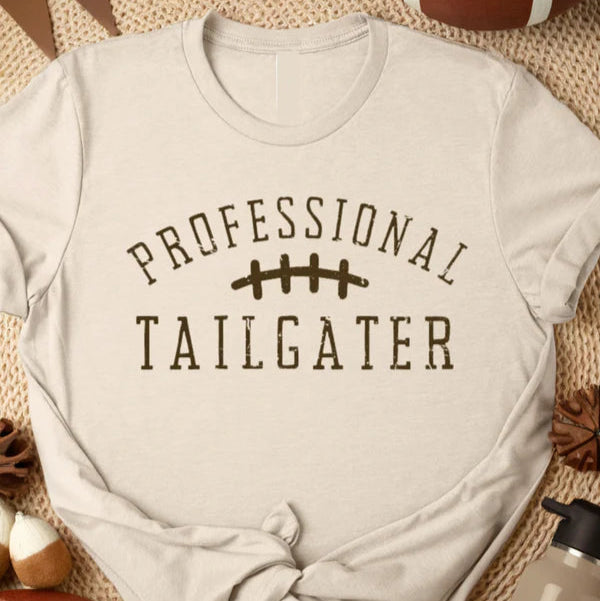 Short sleeve light brown tee that says "professional tailgater"