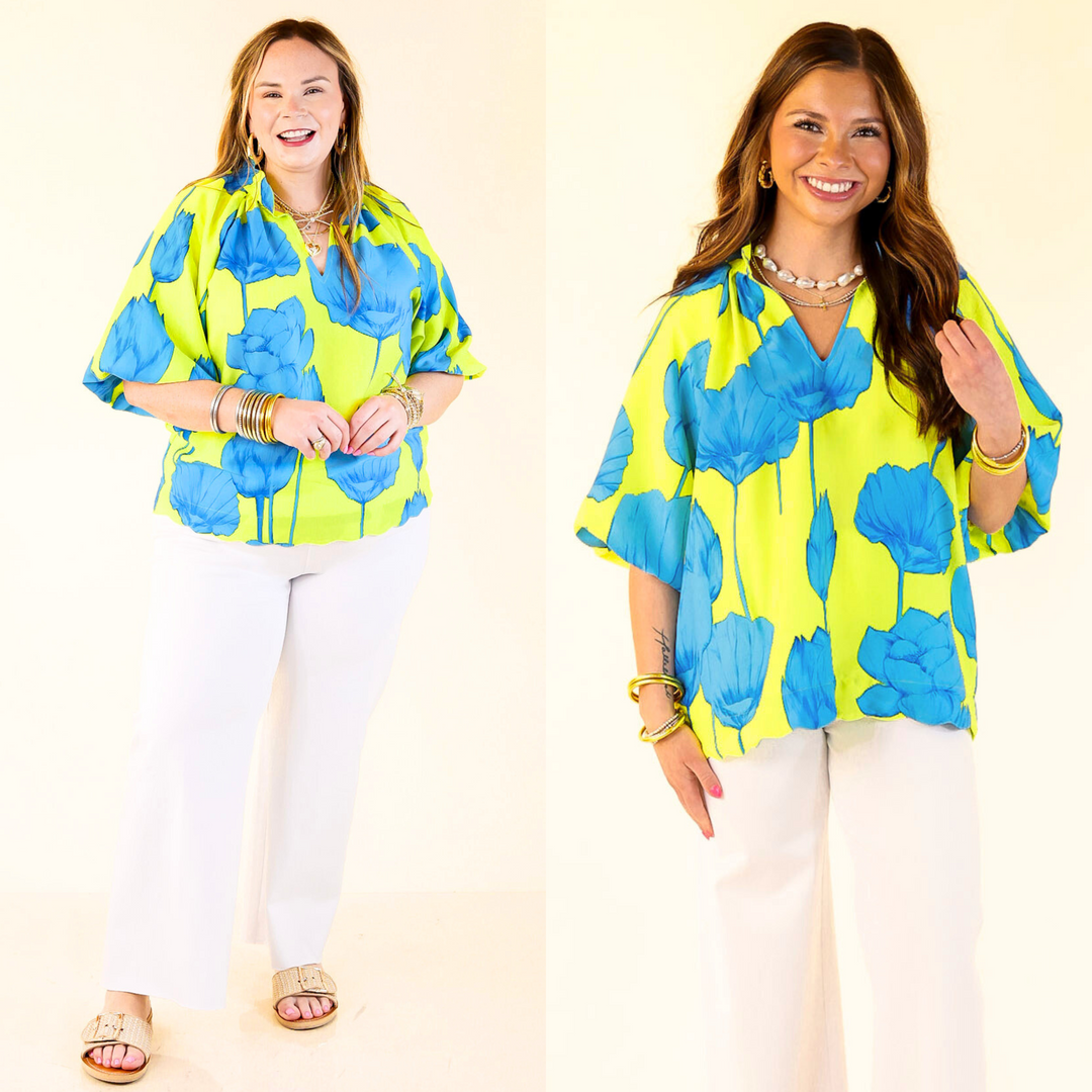 Lime green with bold blue blooms, a flattering V-neck, puff sleeves, and a playful wave hem. Sizes small through Large.