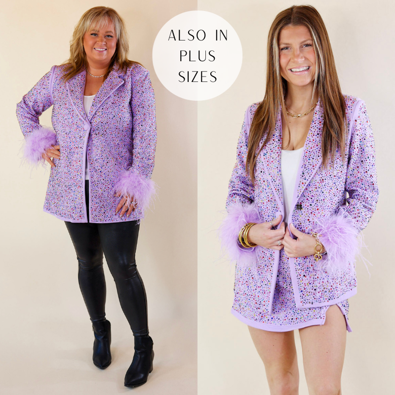 Models are wearing crystal studded Queen Of Sparkless blazer in lavender purple. Plus Size model has it paired with black leather pants, black booties, and silver jewelry. Small model has it paired with a white tank top, the matching skirt, and gold jewelry. 