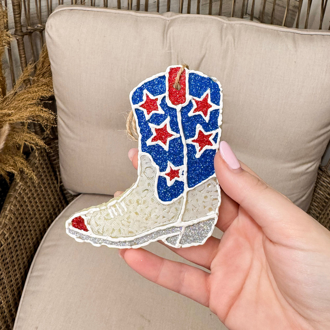 Rustic chain background with patriotic boot freshie held.