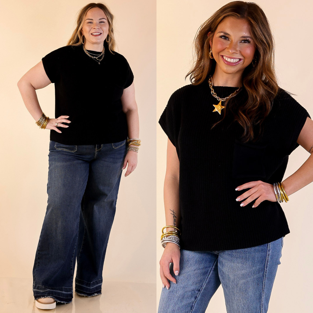 Models are wearing Cap Sleeve Sweater with Front Pocket in Black with blue jeans against a beige background