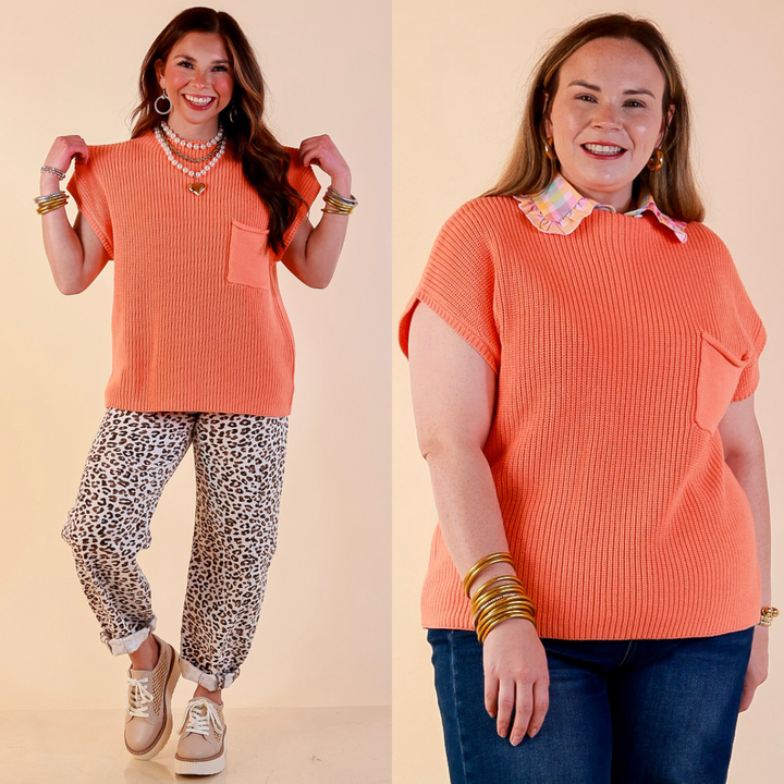 Models are wearing Cap Sleeve Sweater with Front Pocket in Coral Orange with Jeans against a beige backdrop. 