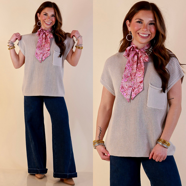 Model is wearing Cap Sleeve Sweater with Front Pocket in Stone Beige with Jeans against a beige backdrop. 