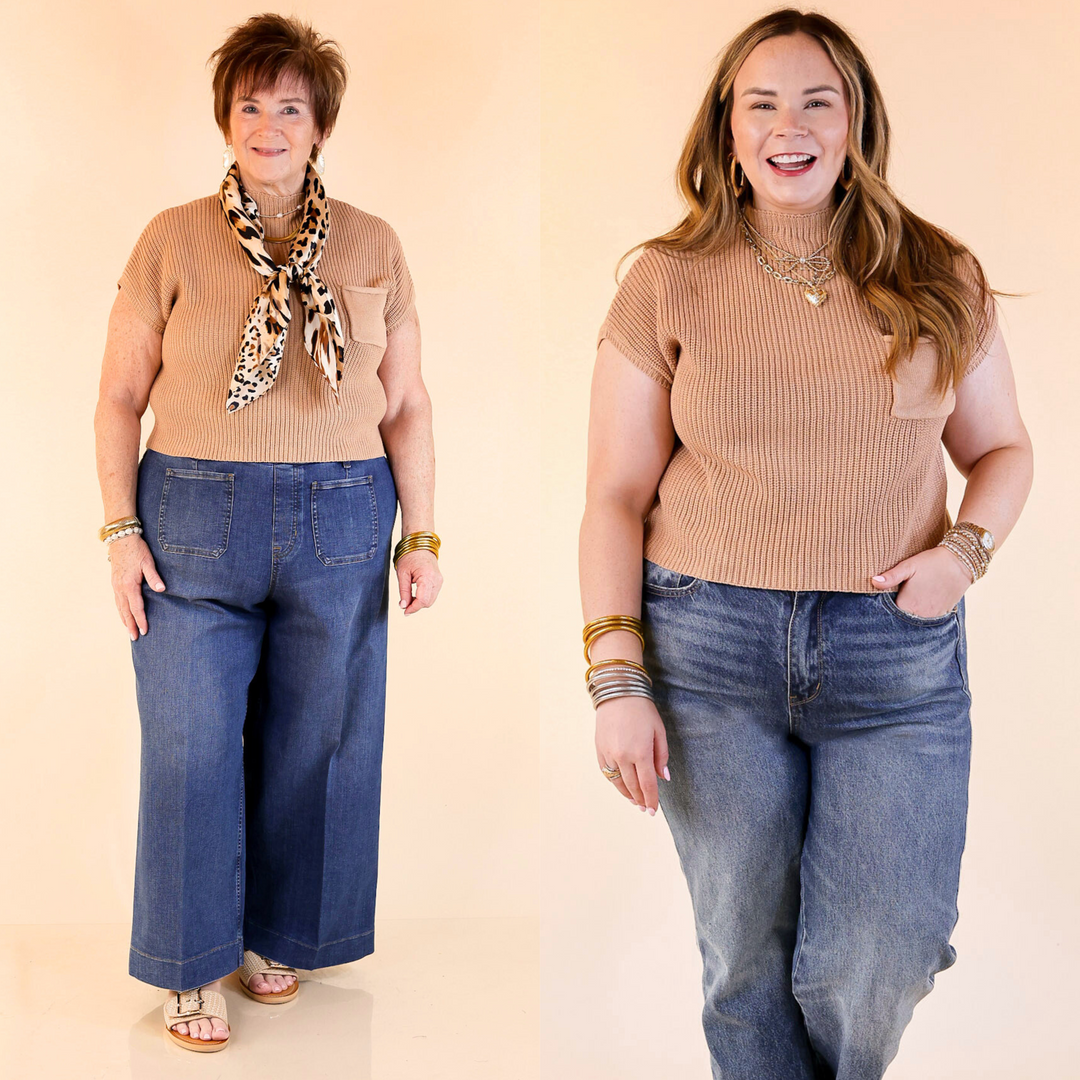 Designed with a chic mock neck, short sleeves, and a stylish front pocket, this versatile sweater top is perfect for effortless everyday wear. Sizes small through large.