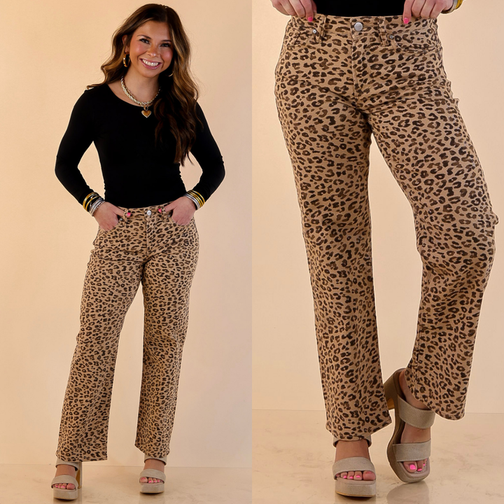 Model is wearing leopard print slim straight pants in camel brown with a plain background