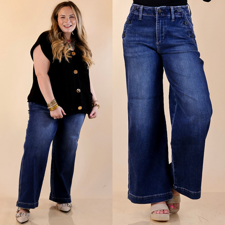 Models are wearing Wide Leg Trouser Jean with Pocket Detailing in Dark Wash with a beige background