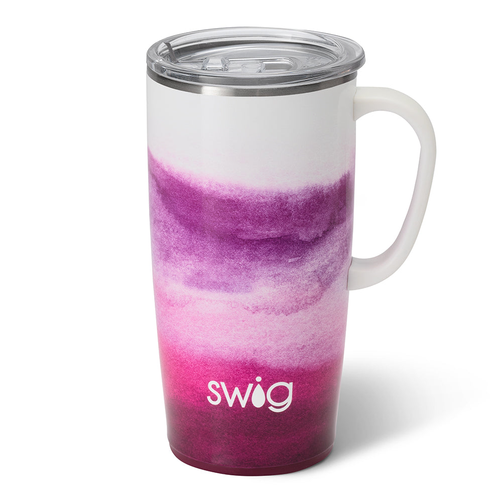 Amethyst 22 oz travel mug. The cup is an Ombre from white to pink to purple. . The cup has a handle and a lid. The background of the picture is white.