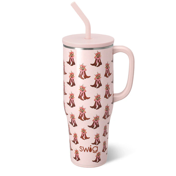 40oz insulated tumbler with cowgirl boots, flowers and pink bows. This tumbler has a comfort-grip handle, double-walled vacuum-sealed copper-plated design, X-Large Straw Lid with silicone gasket. Fits most standard cup holders.