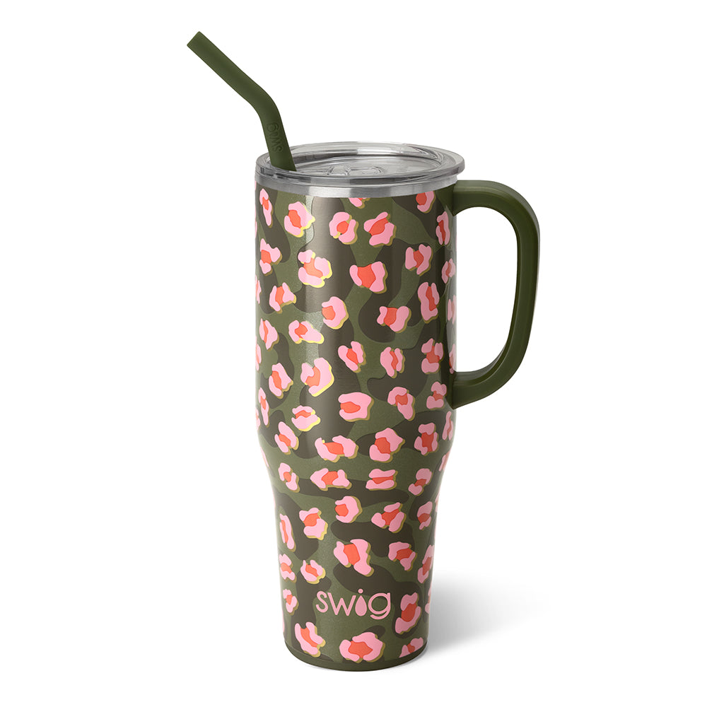 On the Prowl 40 oz mega mug. This cp is green tones with pink detailing. The cup has a green handle and straw. The background of the picture is white.