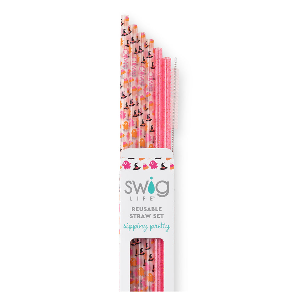 Hey boo swig reusable halloween straws. Four of the straws are halloween themed and two of them are hot pink with sparkles. The background of the picture is white.