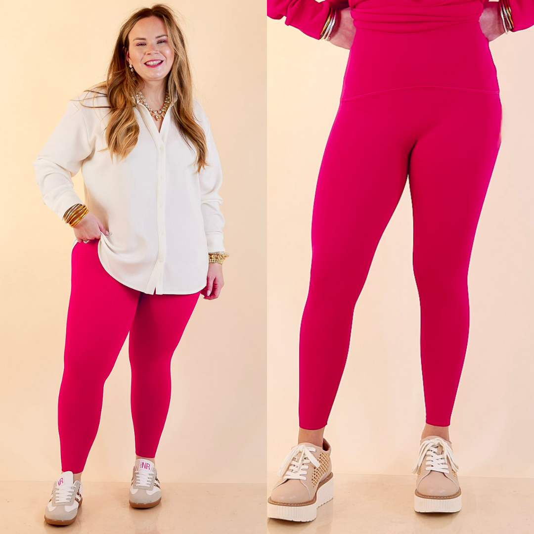 Models are wearing SPANX Booty Boost Performance and Shaping 78 Leggings in Fuchsia Pink against a beige backdrop. 