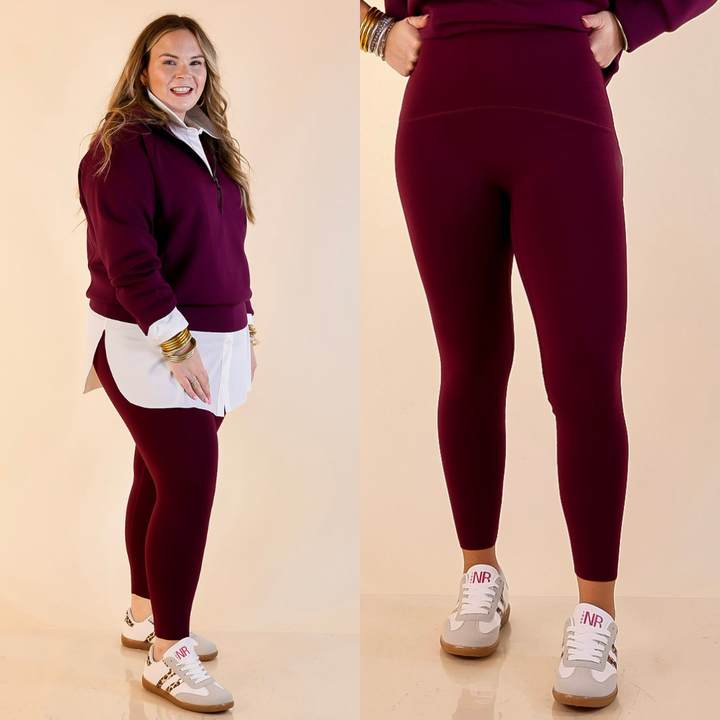 Models are wearing SPANX booty boost 7/8 Leggings in Plum Berry Maroon on a beige background