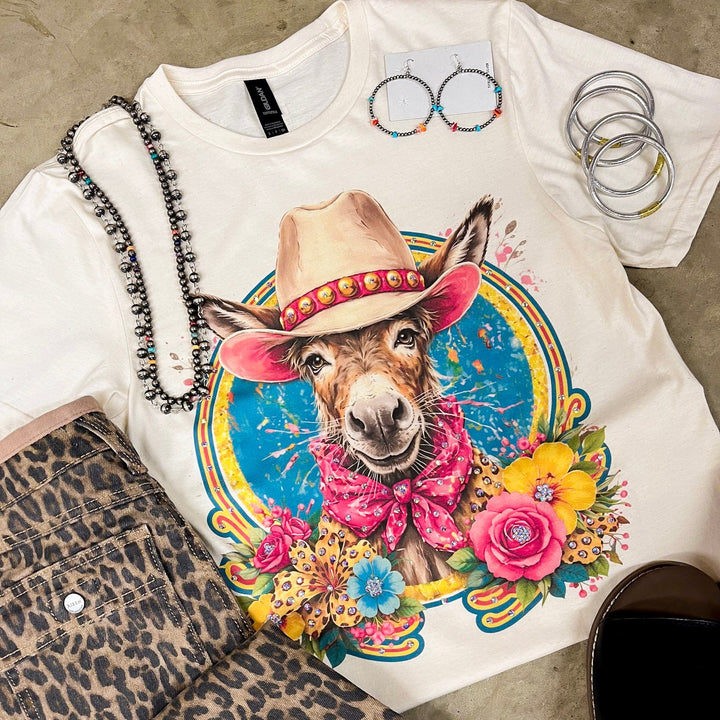 T-shirt with a colorful donkey graphic on a leopard print surface