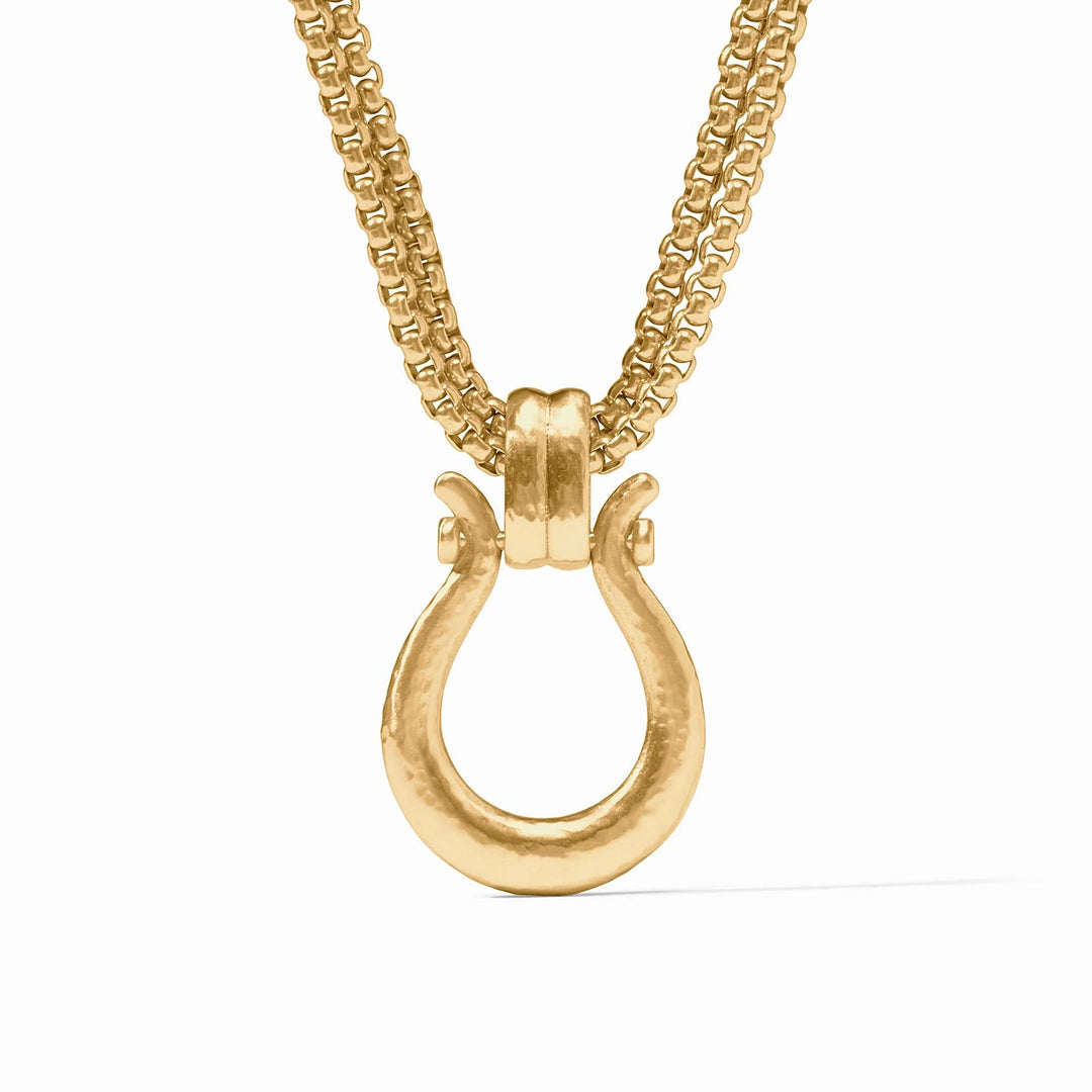 Gold necklace with a unique clasp on a white background