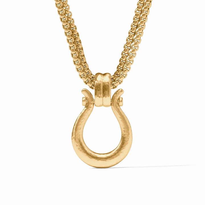Gold necklace with a unique clasp on a white background