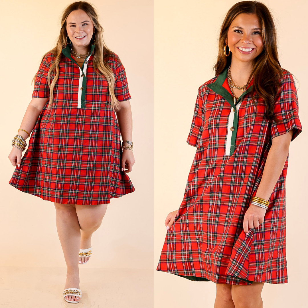 Two women wearing red plaid dresses on a beige background.