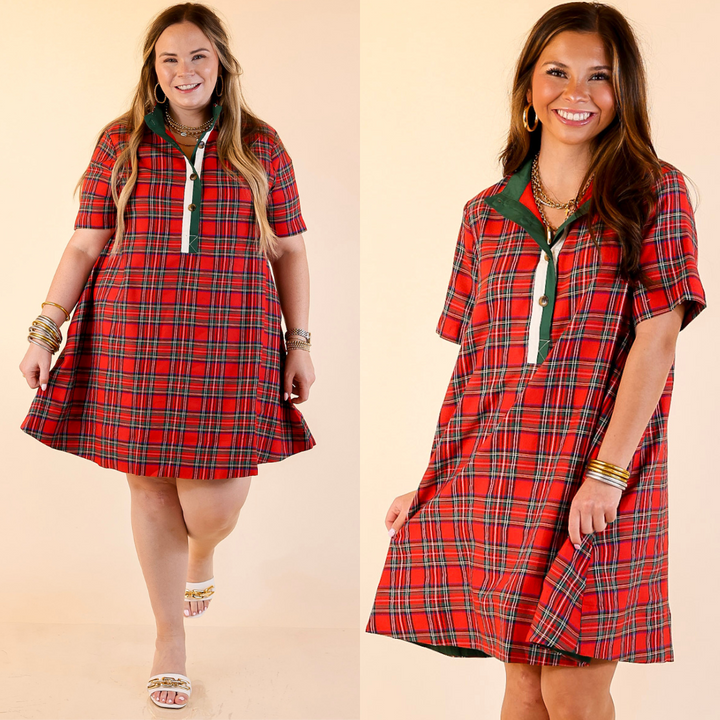 Two women wearing red plaid dresses on a beige background.