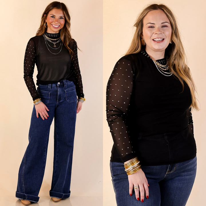 Models are wearing black rhinestone detailed mesh long sleeve top and blue jeans on a beige background
