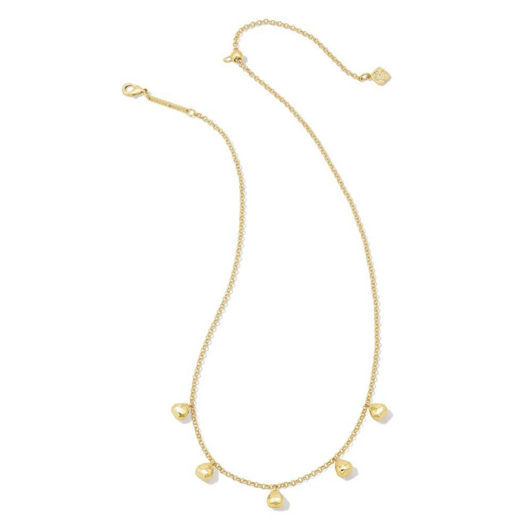 Gold chain necklace with five, gold bead charms hanging at the bottom of the necklace. This necklace is pictured on a white background. 