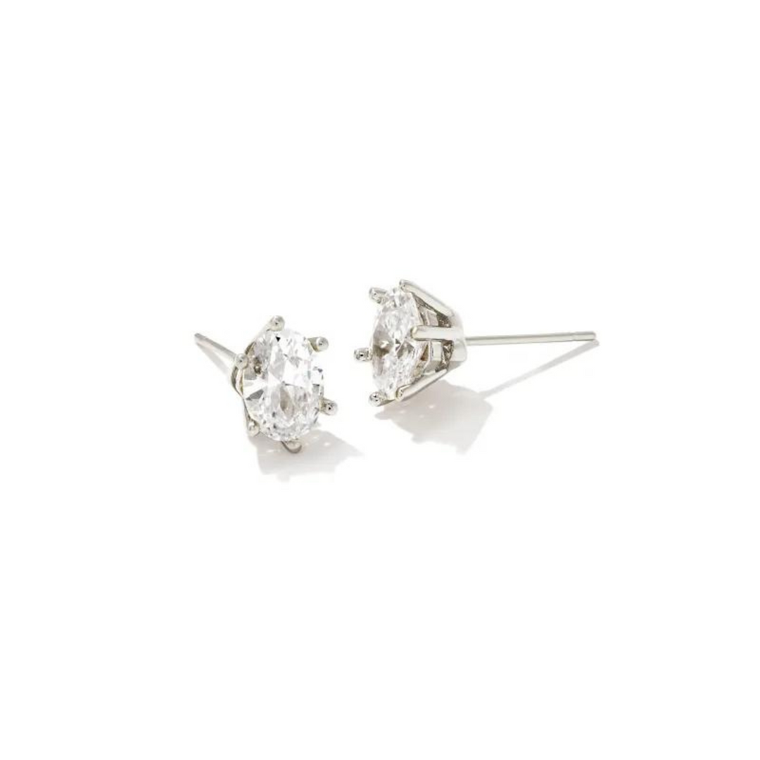 Pictured on a white background is a pair of silver stud earrings with a single oval, clear crystal. 
