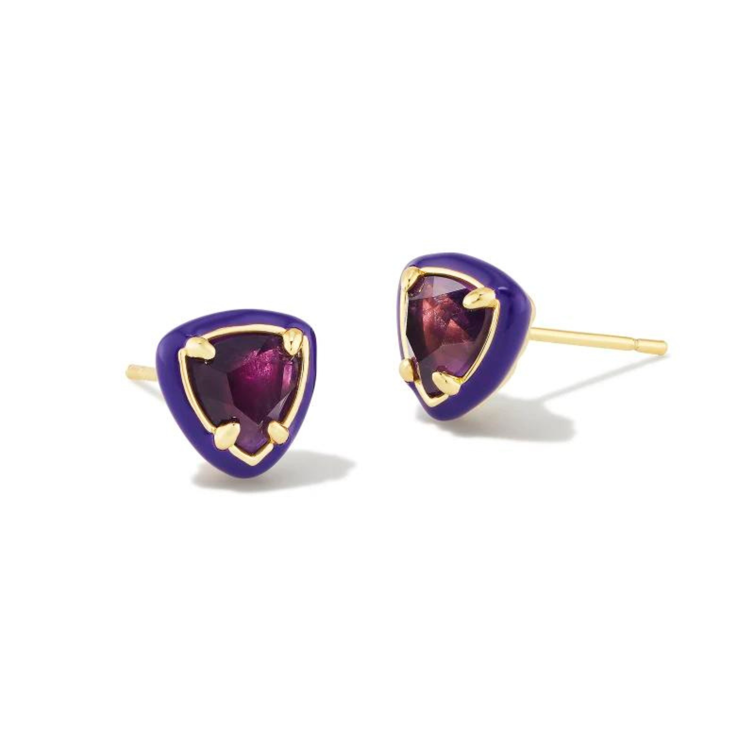 Purple framed, triangle shaped stud earrings with a center purple stone and a gold ear post. These earrings are pictured on a white background. 