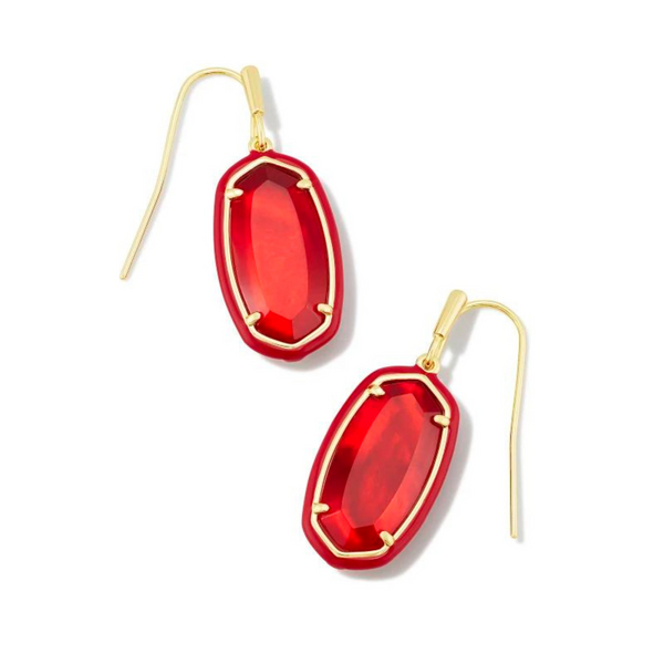 Red framed, oval shaped drop earrings with a center red stone and a gold fish hook earring. These earrings are pictured on a white background. 