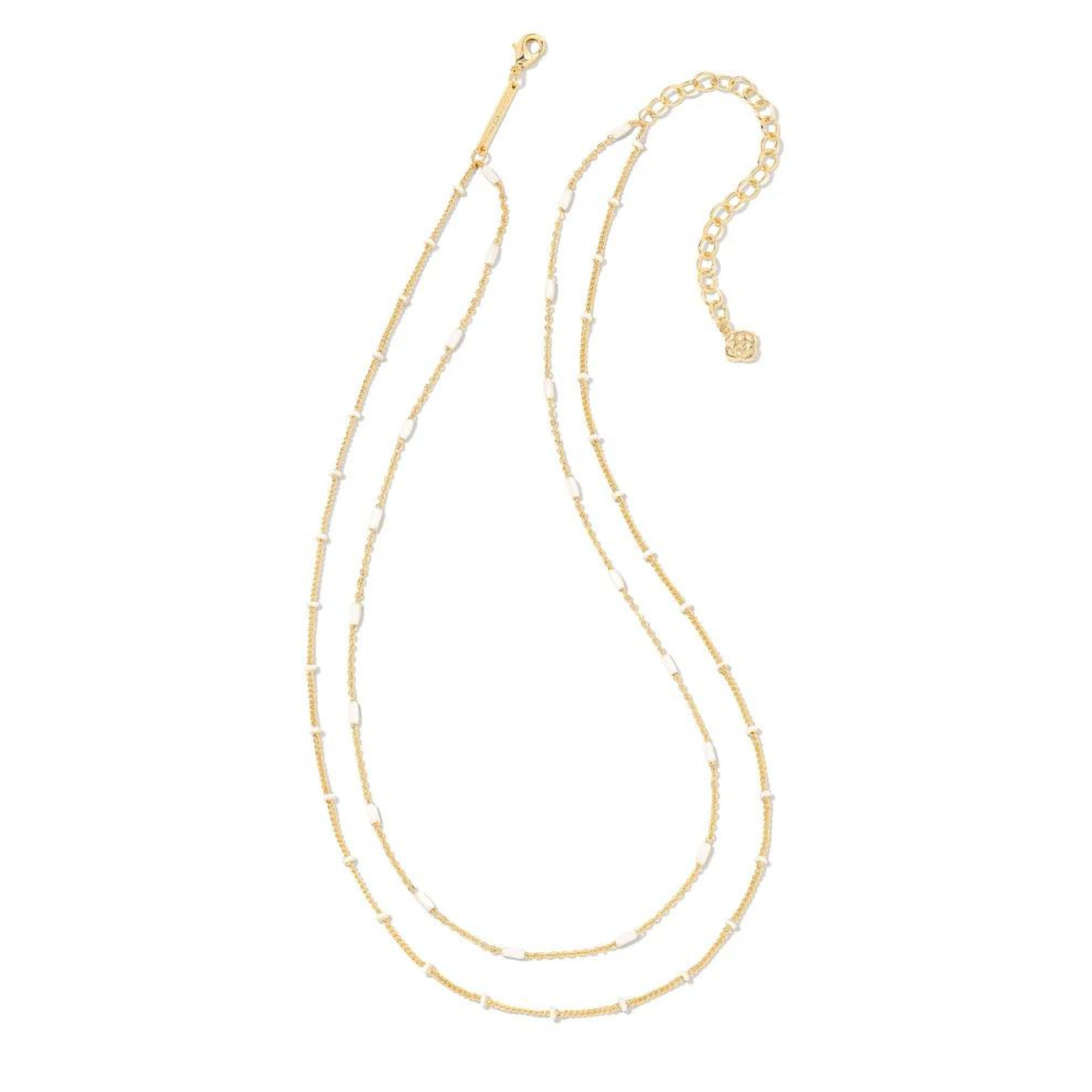 Two strand, adjustable chain necklace with white enamel spacers. This necklace is pictured on a white background. 
