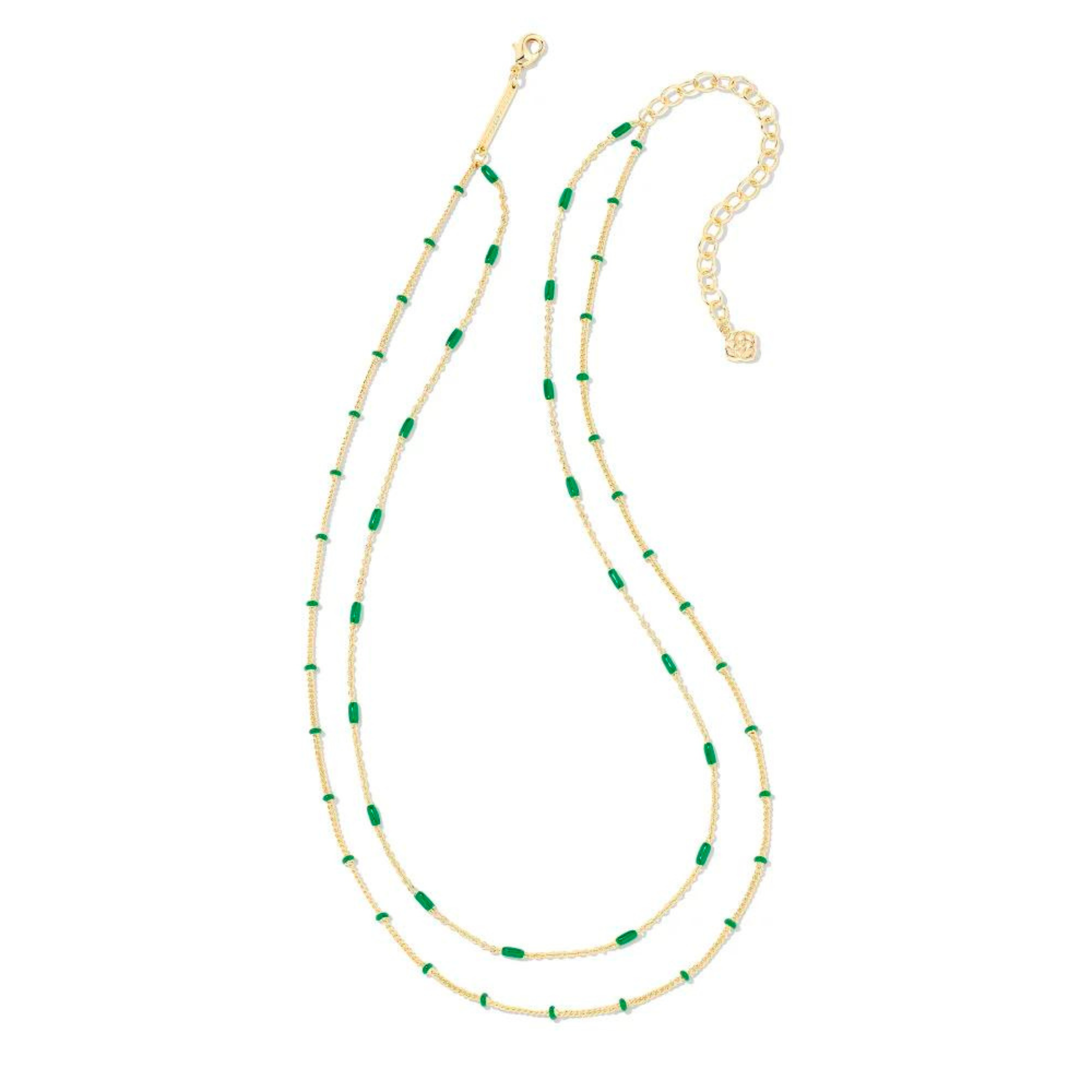 Two strand, adjustable chain necklace with emerald enamel spacers. This necklace is pictured on a white background. 