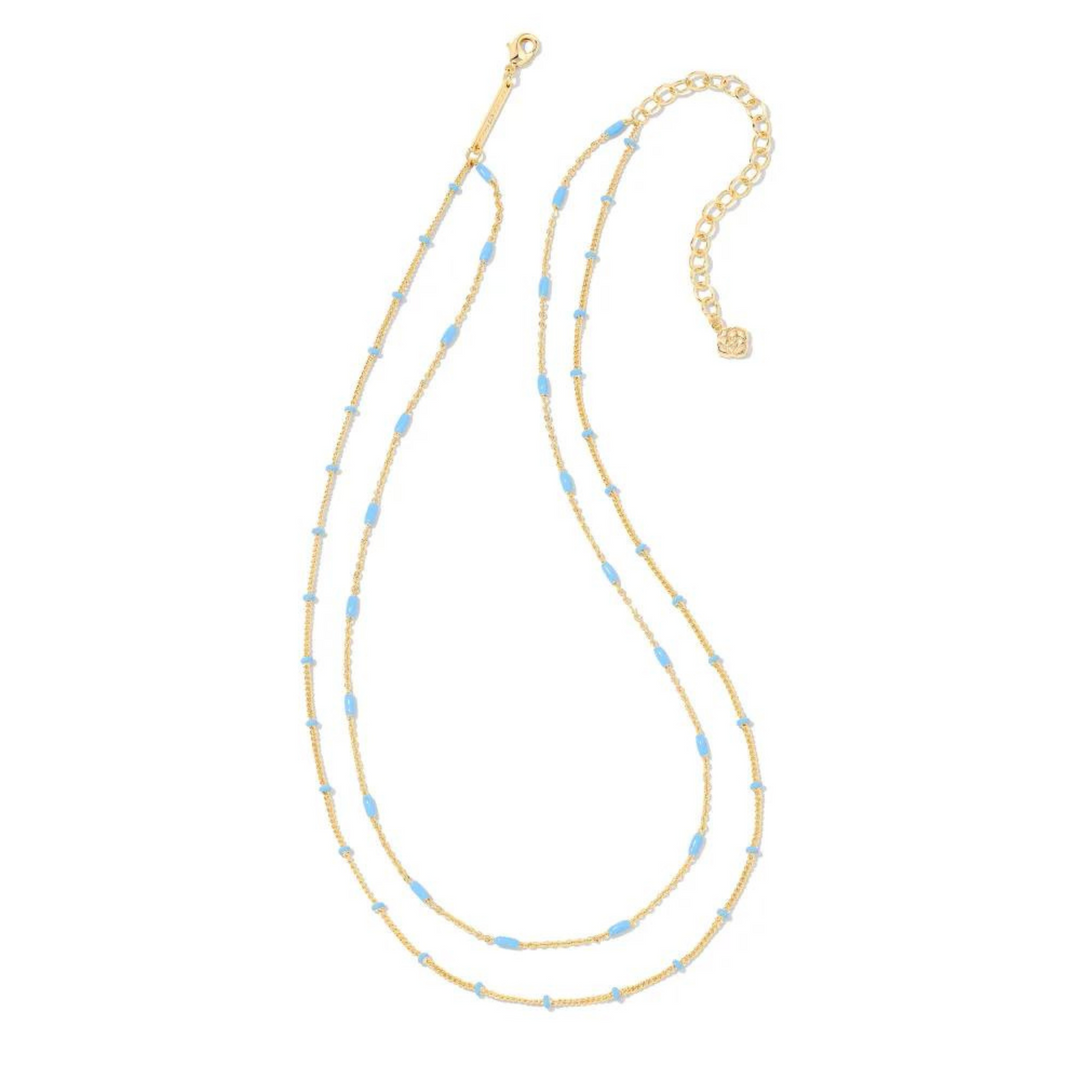Two strand, adjustable chain necklace with periwinkle enamel spacers. This necklace is pictured on a white background. 