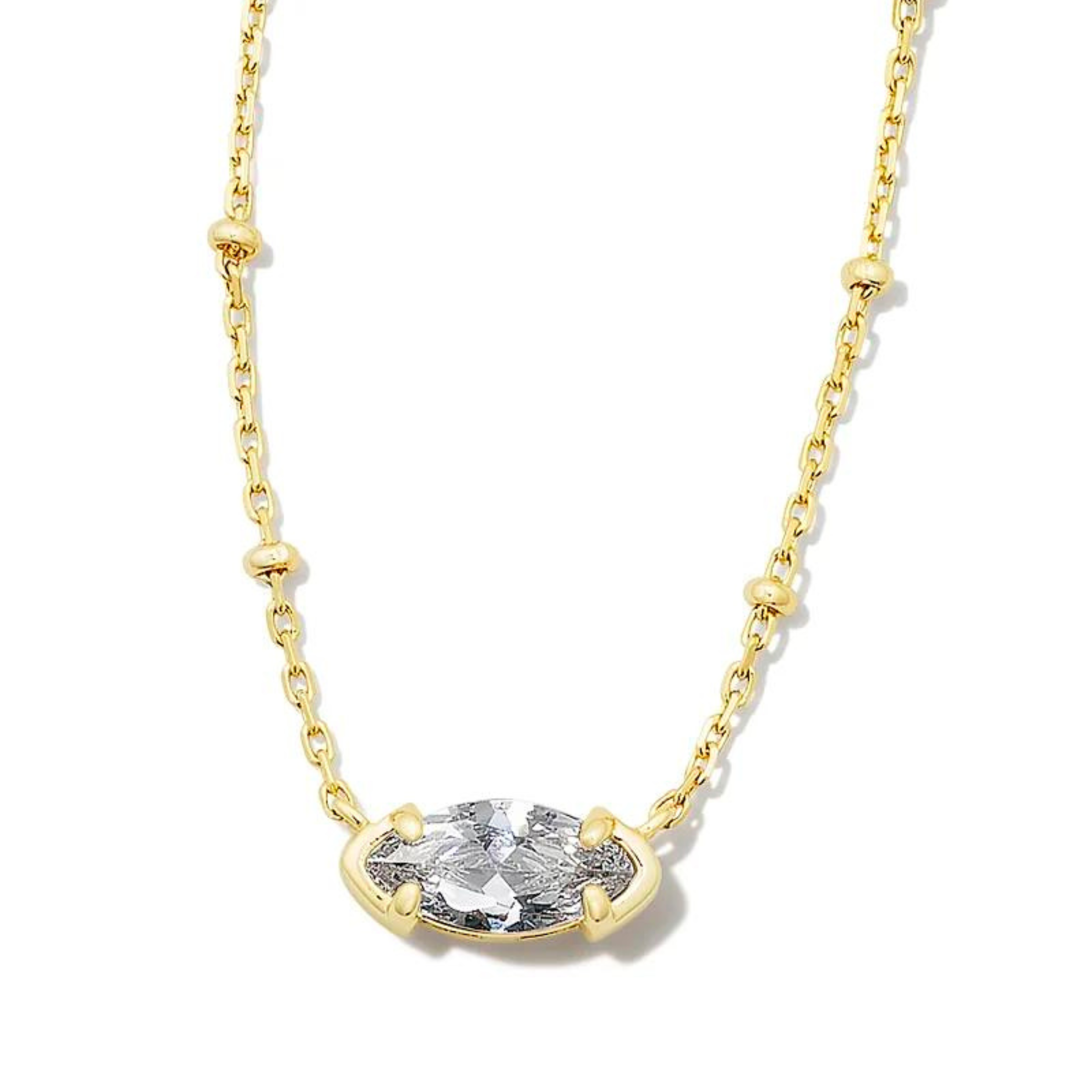 Gold chain necklace with a clear crystal oval pendant. This necklace is pictured on a white background. 