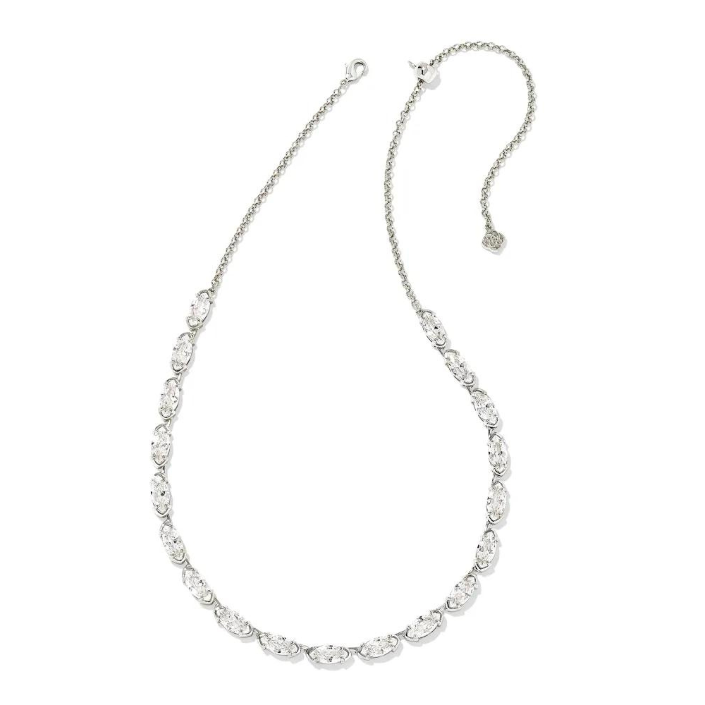 Silver tennis necklace with clear crystals. This necklace is pictured on a white background. 