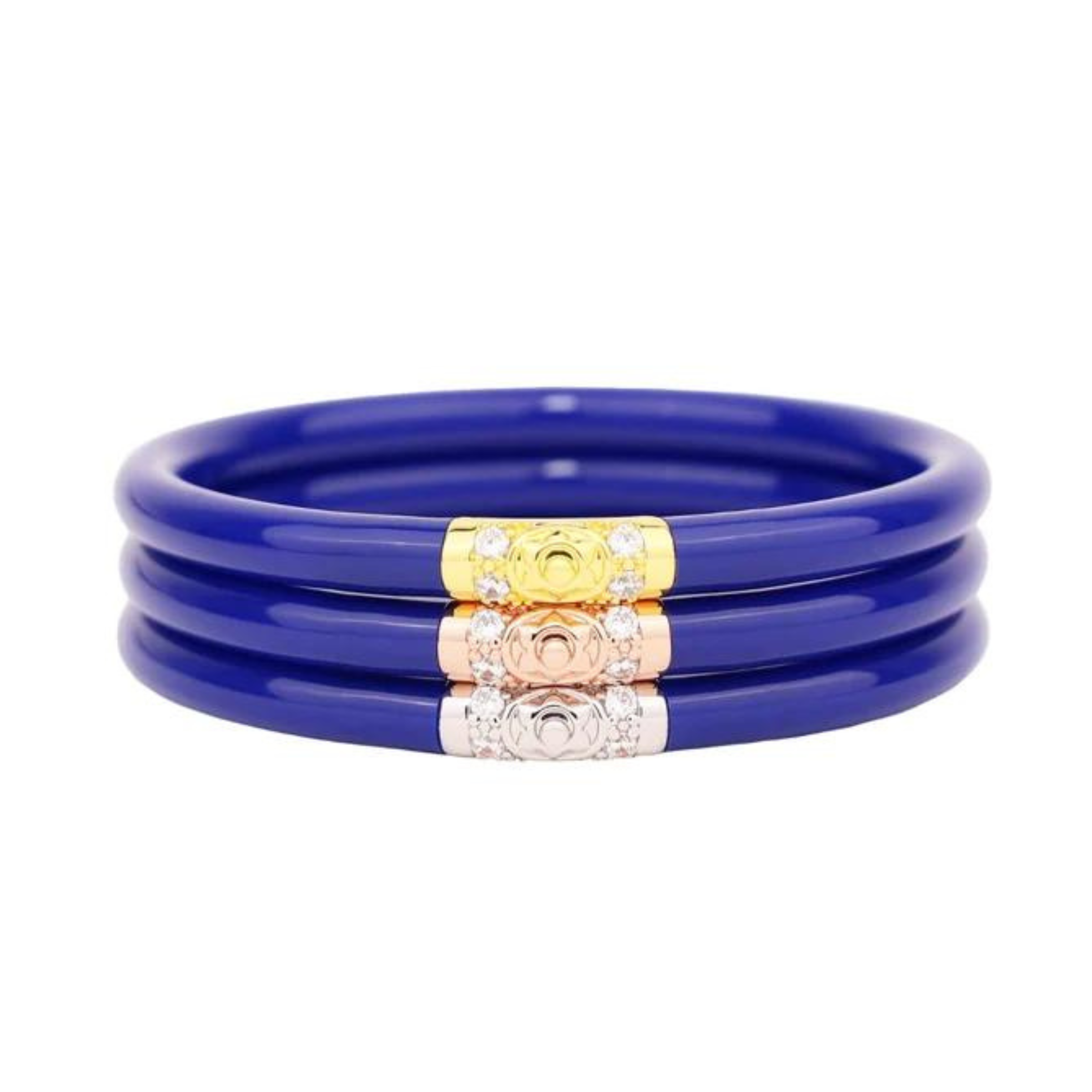 Pictured is a stack of three royal blue bangle bracelets on a white background. 
