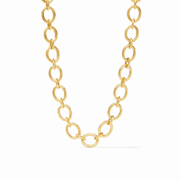 Gold, hammered chain link necklace pictured on a white background. 