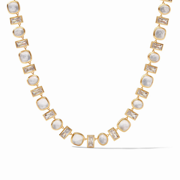 Gold necklace with clear, rectangle crystals and square, iridescent clear crystals linked together. This necklace is pictured on a white background. 